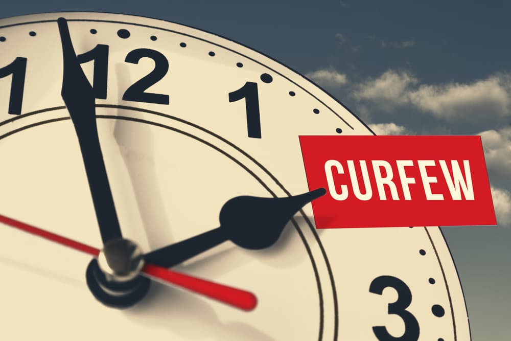 The hand of the clock indicates curfew timing.